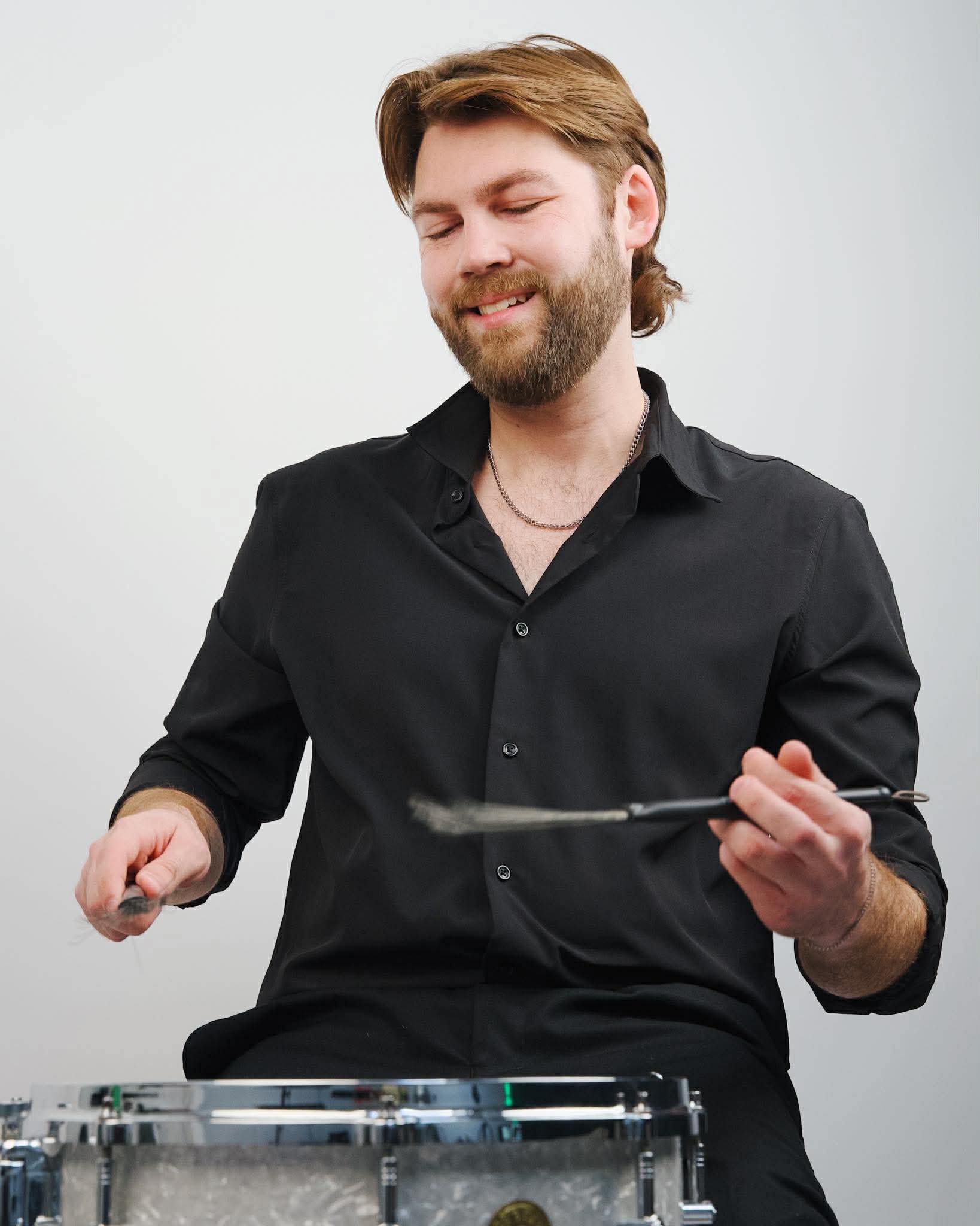 Ben performing with snare drum