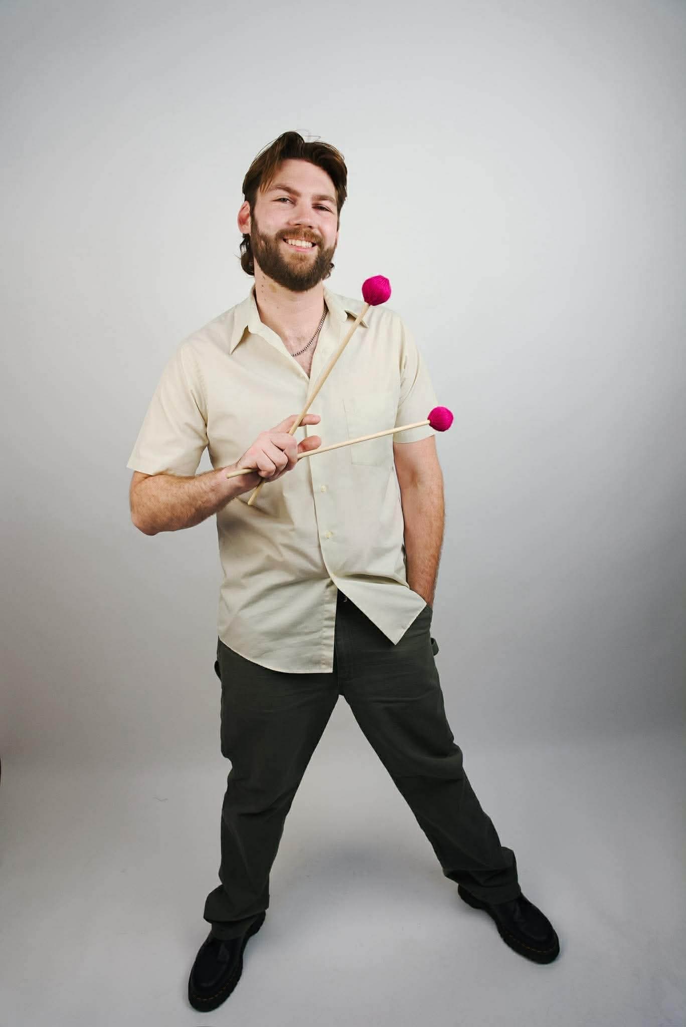 Ben holding pink mallets