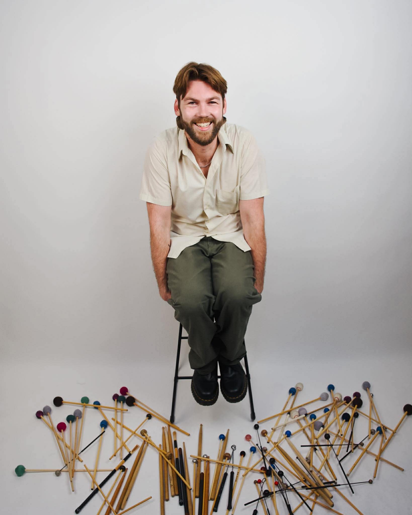 Ben seated with mallets